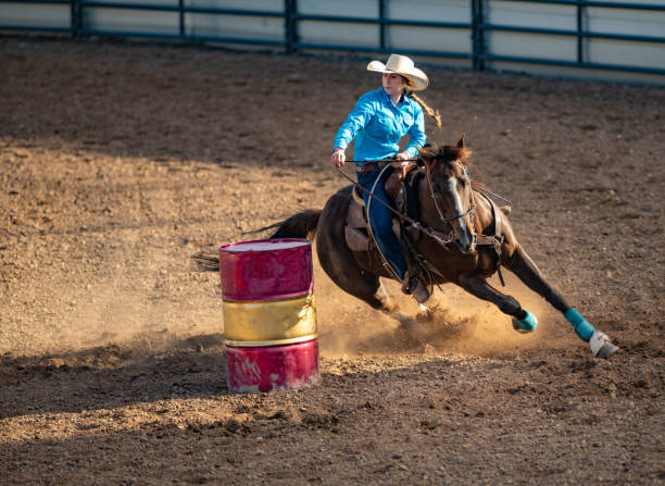 istock Young cowgirl barrel racing rodeo 1152905372
