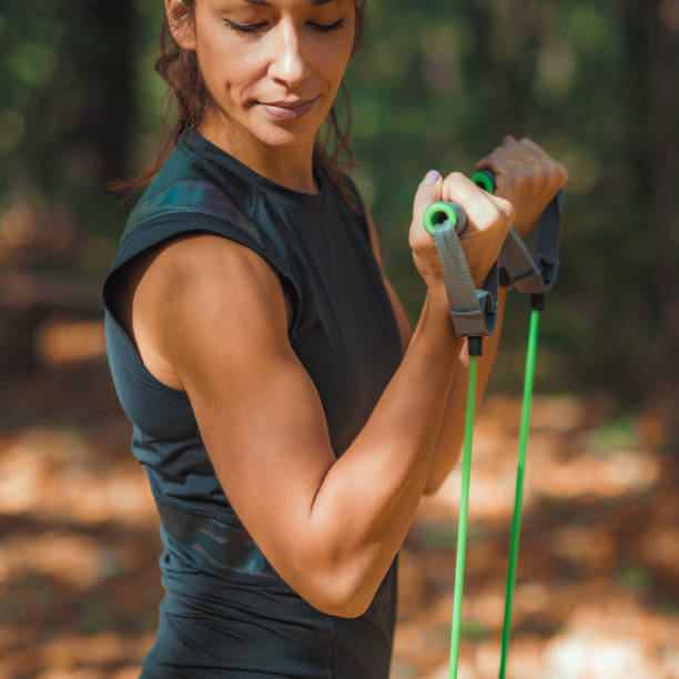 istock Woman exercising in the park 1152908012