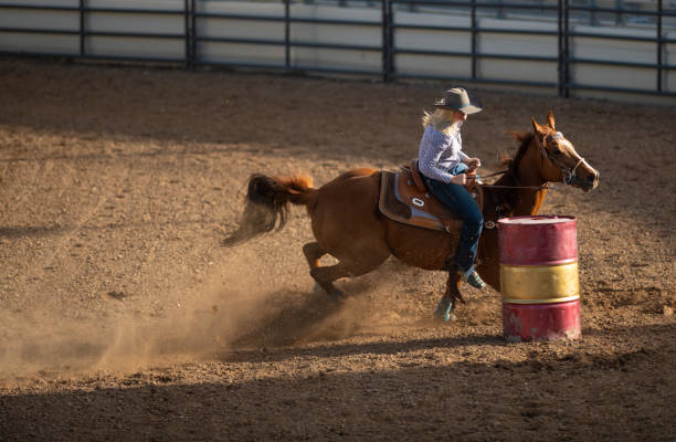 istock Young cowgirl barrel racing rodeo 1152908554