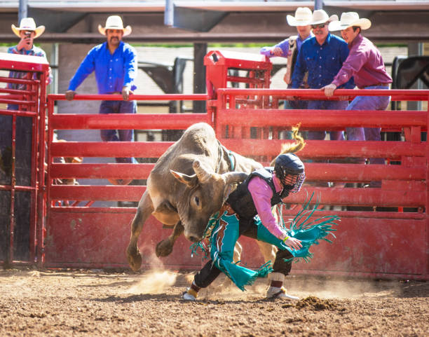 istock Cowboy Bull Riding in Rodeo Arena 1152909219