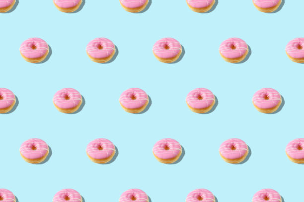 istock Trendy summer pattern with pink donut on bright blue background. Minimal summer concept. 1152910358