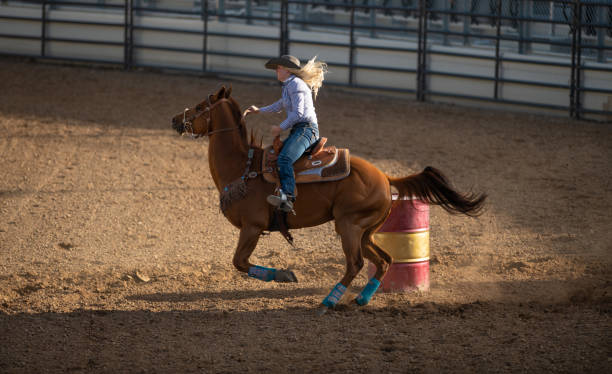 istock Young cowgirl barrel racing rodeo 1152910752