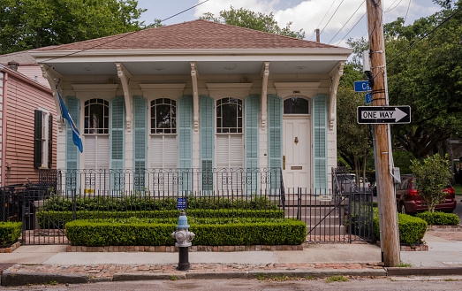 New Orleans, LA, USA -- May 26, 2019.  Photo of traditional house on a corner lot in the Garden District  in New Orleans, LA.