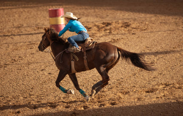 istock Young cowgirl barrel racing rodeo 1152911627