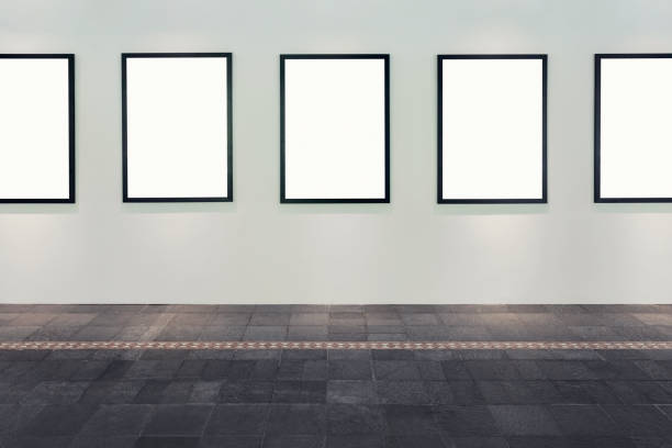 A gallery with a wall of blank frames in a row. Includes clipping path.