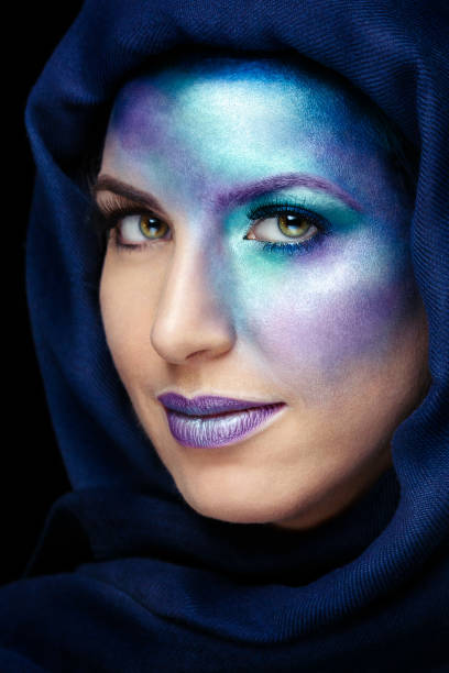 Woman using galaxy conceptual makeup Woman using galaxy conceptual makeup. human eye nebula star space stock pictures, royalty-free photos & images