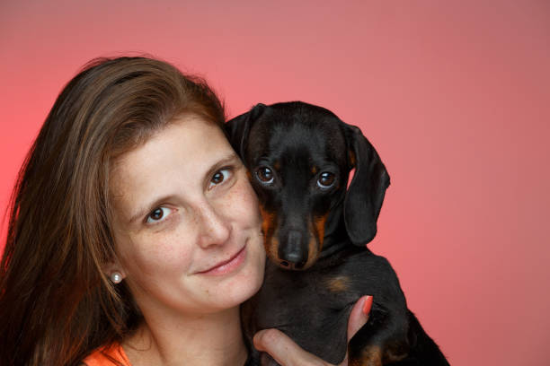 Woman hugging her dog.