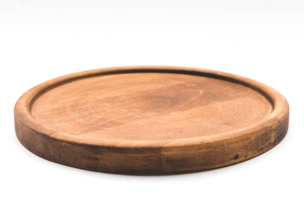 Round wooden plate Round wooden pizza plate tray stock pictures, royalty-free photos & images