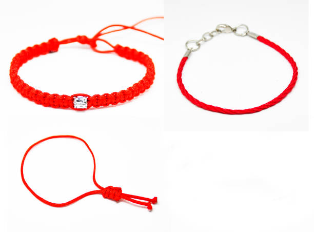 istock delicate decorative bracelet woven from red rope. 1152918202