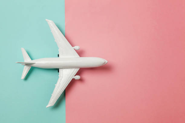 istock Toy plane on colorful pink and blue background 1152918937