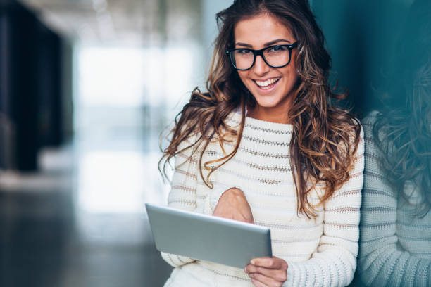 istock Beautiful woman with digital tablet 1152919122