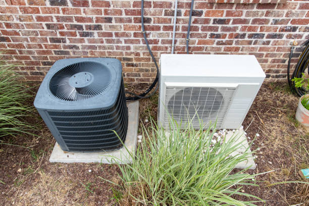 istock Regular home HVAC air conditioner system and mini-split next to each other. 1152925463