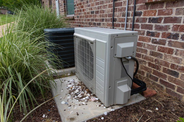 istock Regular home HVAC air conditioner system and mini-split next to each other. 1152925483