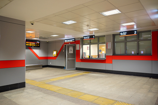 A train platform with railway tracks either side of it in Toulouse, France. There are no trains on the tracks.