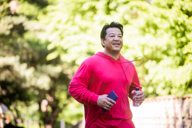 istock Mature Hispanic Man Jogging in Central Park 1152929778