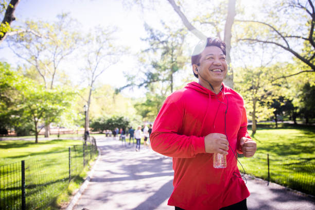 istock Mature Hispanic Man Jogging in Central Park 1152929779