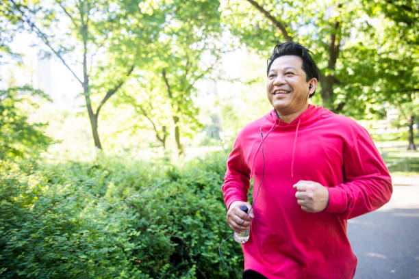 istock Mature Hispanic Man Jogging in Central Park 1152929783