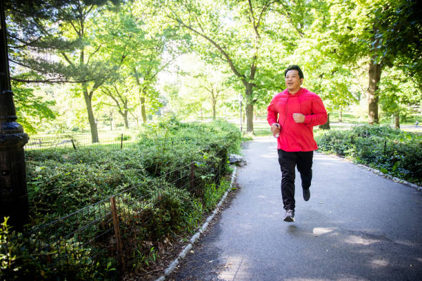 istock Mature Hispanic Man Jogging in Central Park 1152930338