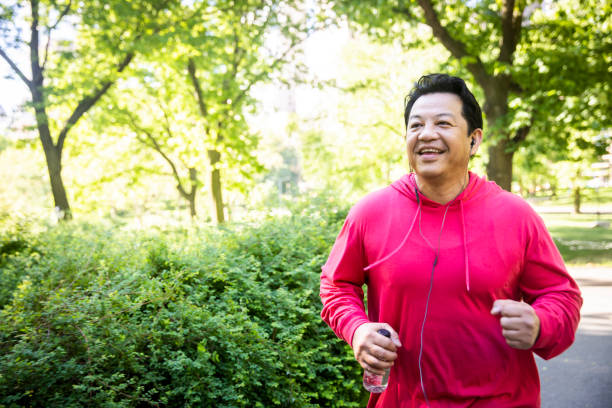 istock Mature Hispanic Man Jogging in Central Park 1152930428