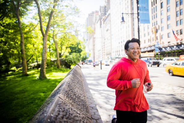 istock Mature Hispanic Man Jogging in New York 1152930429
