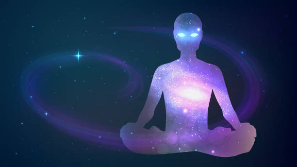 istock Human sitting in the lotus position on cosmos background 1152934991