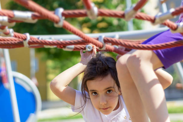 istock Teenage girl creeping under the spider web 1152935608