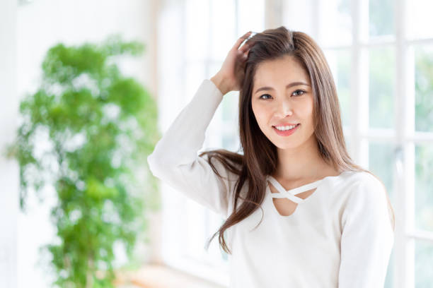 istock attractive asian woman relaxing in room 1152936272