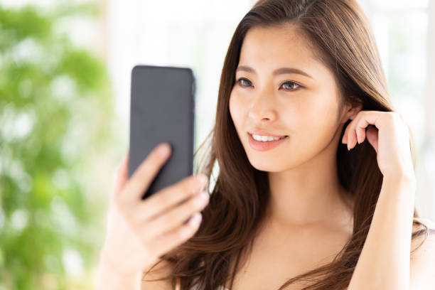 attractive asian woman beauty image attractive asian woman beauty image photographing herself stock pictures, royalty-free photos & images