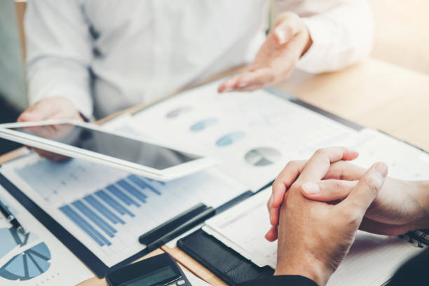 istock Co-working Business Team Consulting meeting Planning with digital tablet Strategy Analysis investment and saving concept. meeting discussing new plan financial graph data. 1152943560