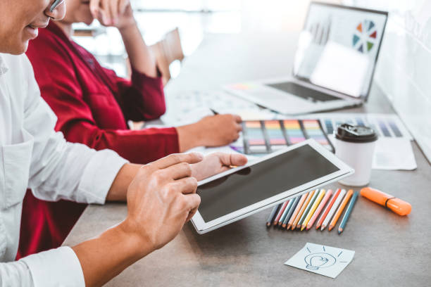 istock Team creative business using tablet planning and thinking of new ideas for success work project in cafe 1152943635