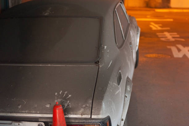 istock Trace of a hand on a car that has been left dusty 1152943786
