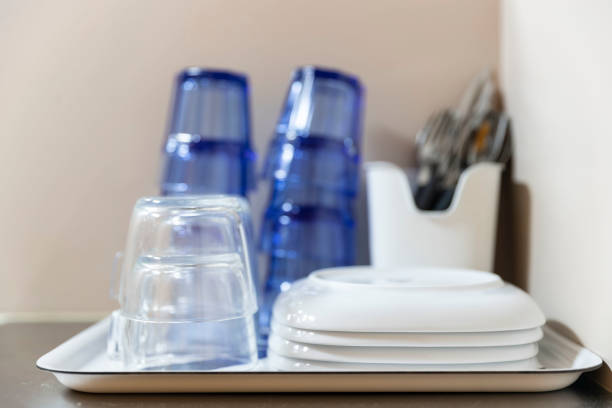 Glass and dish placed on the kitchen cabinet