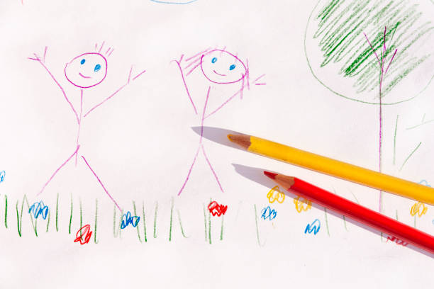 istock children drawing with colored pencils on paper 1152950286