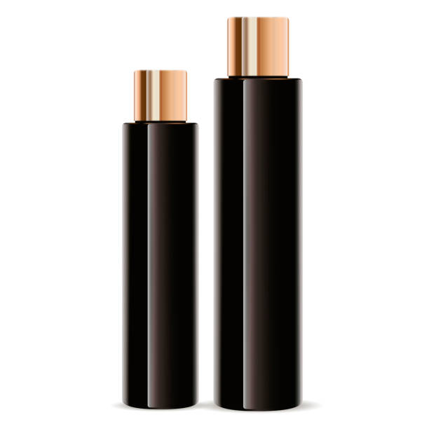 istock Dark amber glass cosmetic bottles set. Cylinder 1152954718