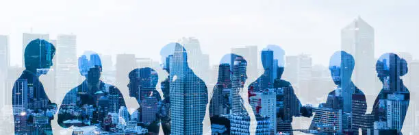 Photo of Double exposure of group of businessperson and cityscape.