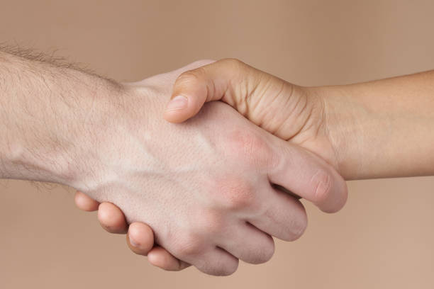 istock Man and woman handshake 1152957268