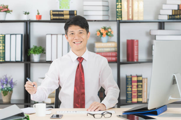 istock Asian business man at office 1152961622