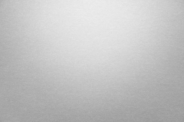 Abstract grey glossy paper texture background Abstract grey glossy paper texture background or backdrop. Empty gray cardboard or shiny paperboard for decorative design element. Simple grainy textured surface for journal template presentation aluminum stock pictures, royalty-free photos & images