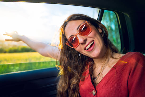 istock Young woman in a car with open window 1152971417