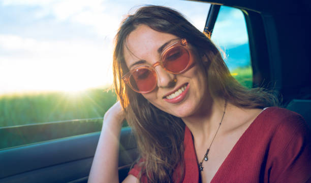 istock Young woman in a car with open window 1152971418