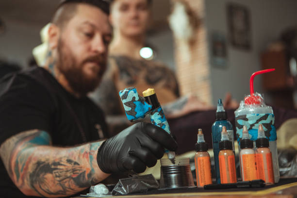 Man getting new tattoo by professional tattooist