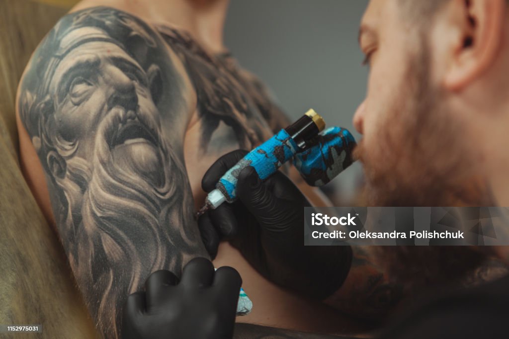 Man Getting New Tattoo By Professional Tattooist Stock Photo - Download  Image Now - Adult, Art, Artist - iStock