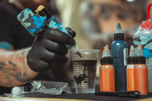 istock Man getting new tattoo by professional tattooist 1152975034