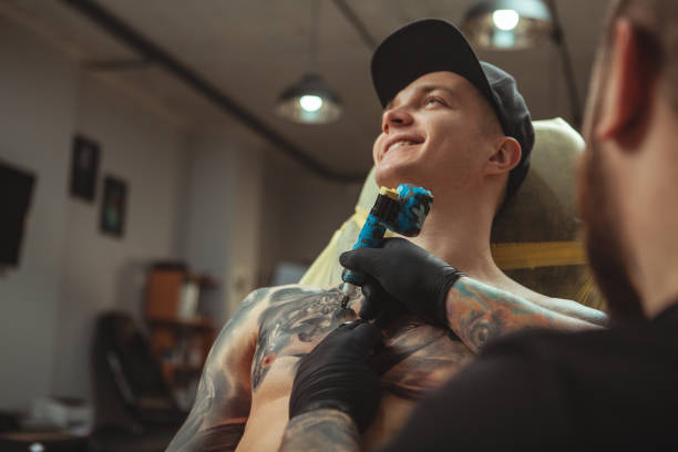 istock Man getting new tattoo by professional tattooist 1152975112
