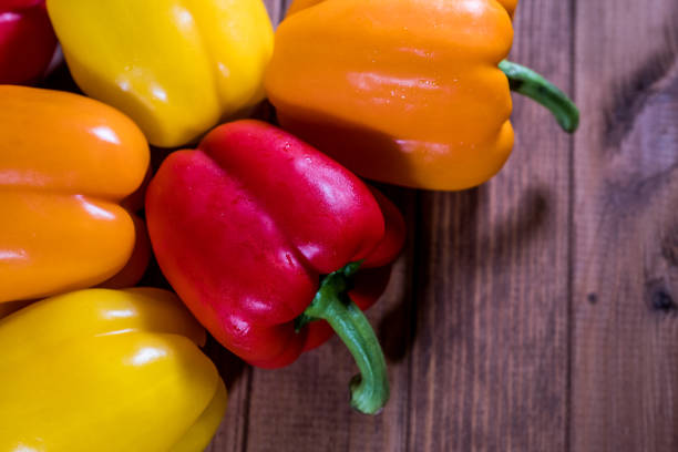 istock Colorful fresh paprika on a dark wooden table 1152976185