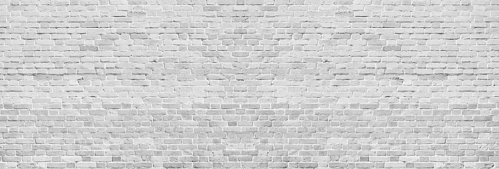 Amplia textura de pared de ladrillo lavado blanco. Ladrillo Vintage gris claro en bruto. Fondo panorámico encalado photo