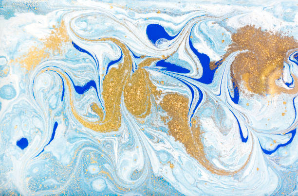 istock White, blue and gold marbling pattern. Golden marble liquid texture. 1152978343