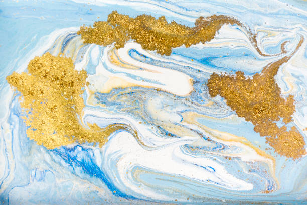 istock White, blue and gold marbling pattern. Golden marble liquid texture. 1152978444