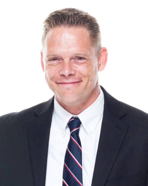 istock Businessman is talking on the phone while standing next to suitcase 1152978516