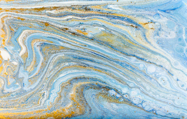 istock White, blue and gold marbling pattern. Golden marble liquid texture. 1152978534
